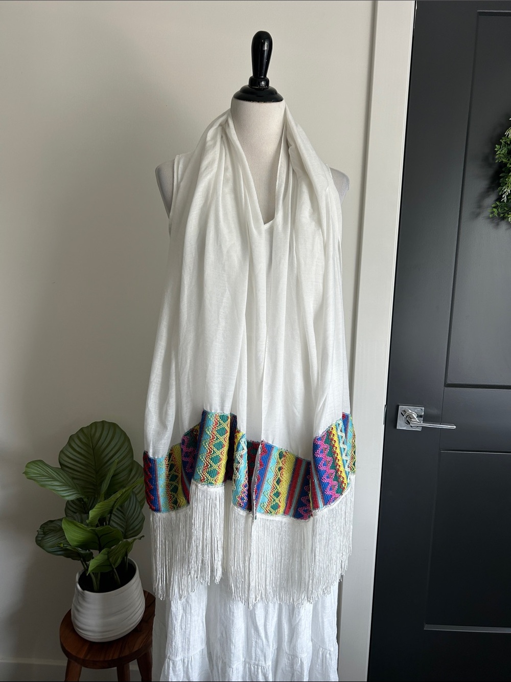 World Market white fringe scarf with red blue yellow green stitching